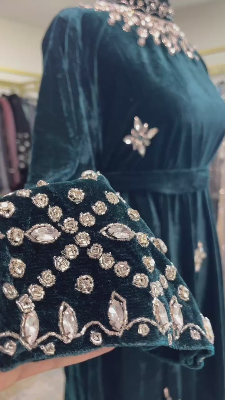 Dark green velvet abaya gown with silver rhinestone beadwork on sleeves and neckline